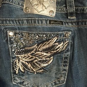 Miss Me mid-rise easy boot cut jeans size 32.